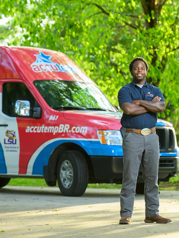 AccuTemp Team Member next to AccuTemp work van.